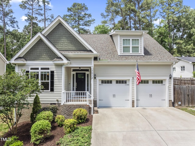 3914 Old Chapel Hill Rd, Durham, NC 27707 - view of front of property featuring fence, driveway, a shingled roof, and an attached garage