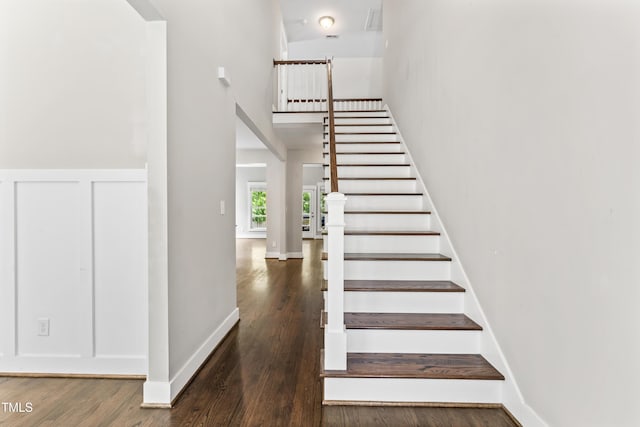 3914 Old Chapel Hill Rd, Durham, NC 27707 - stairway with wood finished floors, a high ceiling, and baseboards