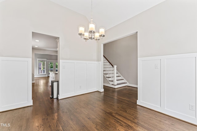 3914 Old Chapel Hill Rd, Durham, NC 27707 - empty room featuring a decorative wall, a chandelier, stairs, dark wood-style floors, and wainscoting