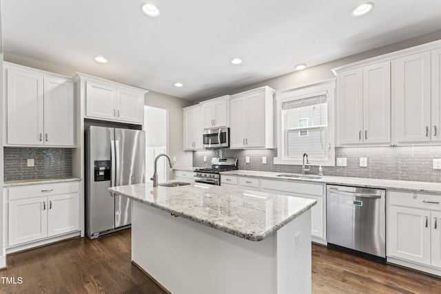 3914 Old Chapel Hill Rd, Durham, NC 27707 - kitchen with stainless steel appliances, a sink, tasteful backsplash, white cabinets, and recessed lighting