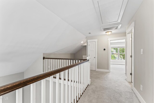 3914 Old Chapel Hill Rd, Durham, NC 27707 - corridor with attic access, light carpet, lofted ceiling, baseboards, and an upstairs landing