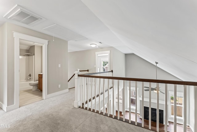 3914 Old Chapel Hill Rd, Durham, NC 27707 - hall with attic access, an upstairs landing, carpet flooring, vaulted ceiling, and baseboards