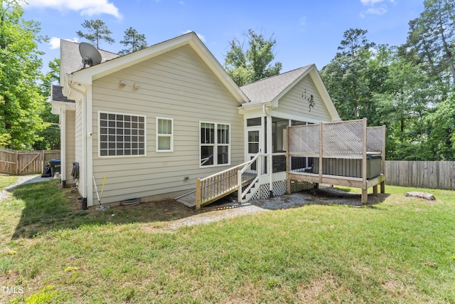 3914 Old Chapel Hill Rd, Durham, NC 27707 - rear view of property featuring a sunroom, a shingled roof, and a deck