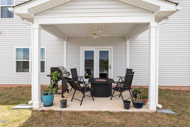 637 Marrian Dr, Clayton, NC 27520 - view of patio with ceiling fan and an outdoor fire pit