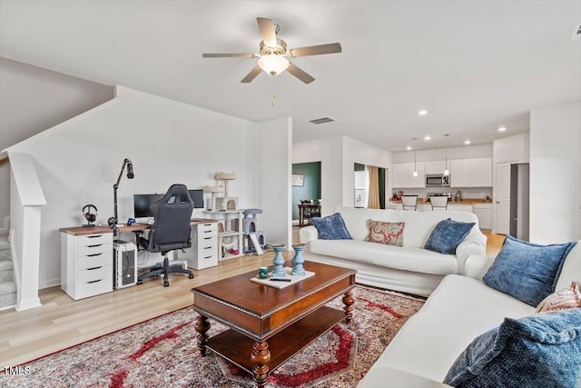 637 Marrian Dr, Clayton, NC 27520 - living room featuring a desk, ceiling fan, light wood finished floors, stairway, and recessed lighting