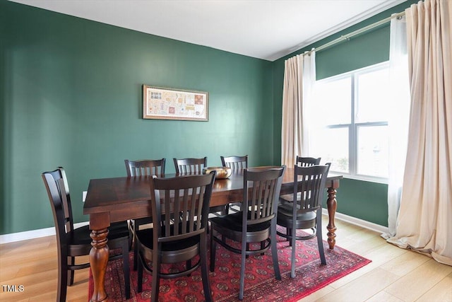 637 Marrian Dr, Clayton, NC 27520 - dining space with healthy amount of natural light, wood finished floors, and baseboards