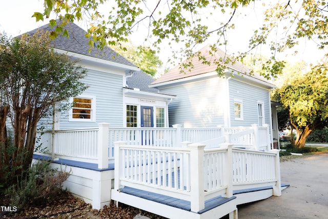 208 Glenn St, Franklinton, NC 27525 - back of house with a wooden deck and roof with shingles