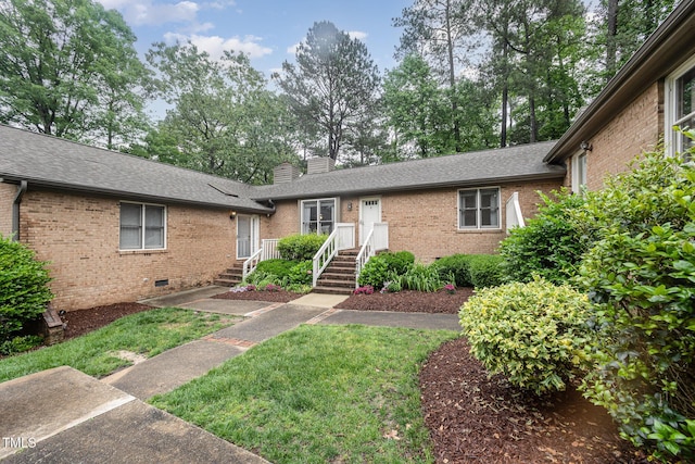 200 W Woodcroft Pkwy Unit 57B, Durham, NC 27713 - view of front of property featuring crawl space, brick siding, a chimney, roof with shingles, and a front yard