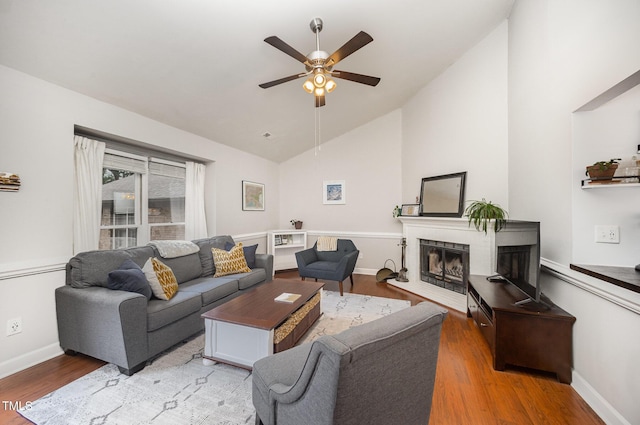 200 W Woodcroft Pkwy Unit 57B, Durham, NC 27713 - living area featuring a ceiling fan, wood finished floors, a fireplace, baseboards, and high vaulted ceiling