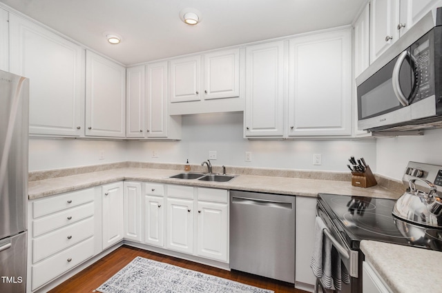 200 W Woodcroft Pkwy Unit 57B, Durham, NC 27713 - kitchen featuring appliances with stainless steel finishes, a sink, and white cabinets