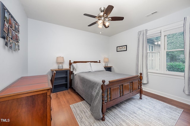 200 W Woodcroft Pkwy Unit 57B, Durham, NC 27713 - bedroom featuring wood finished floors, baseboards, and ceiling fan