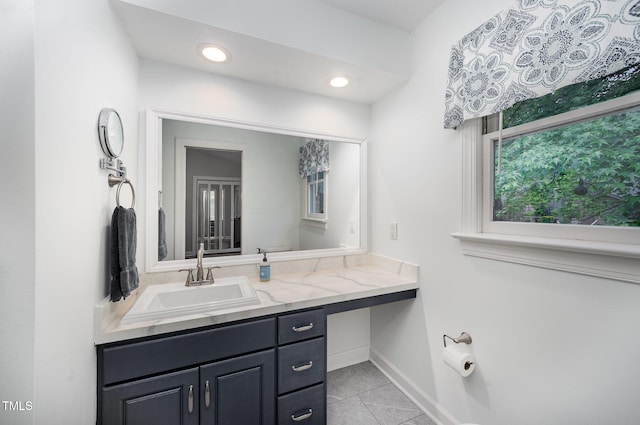 200 W Woodcroft Pkwy Unit 57B, Durham, NC 27713 - bathroom featuring tile patterned flooring, vanity, baseboards, and recessed lighting
