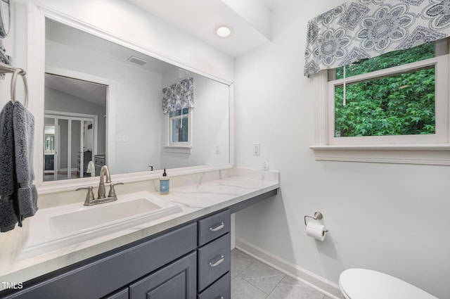 200 W Woodcroft Pkwy Unit 57B, Durham, NC 27713 - half bath featuring toilet, tile patterned floors, baseboards, and vanity