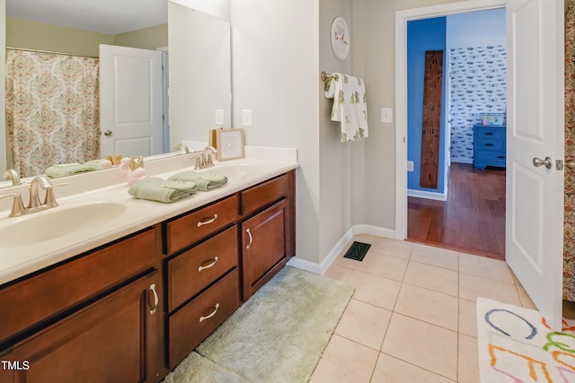 82 Idlewood Ln, Clayton, NC 27527 - bathroom with tile patterned flooring, double vanity, and baseboards