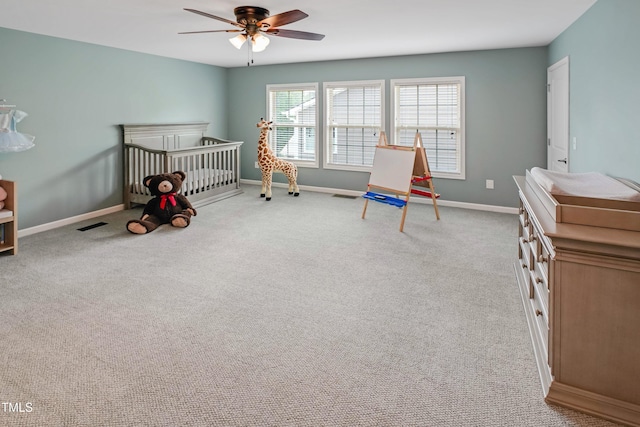 82 Idlewood Ln, Clayton, NC 27527 - bedroom featuring carpet, baseboards, a crib, and a ceiling fan