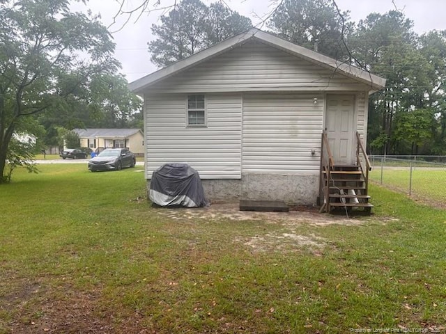 back of property featuring entry steps