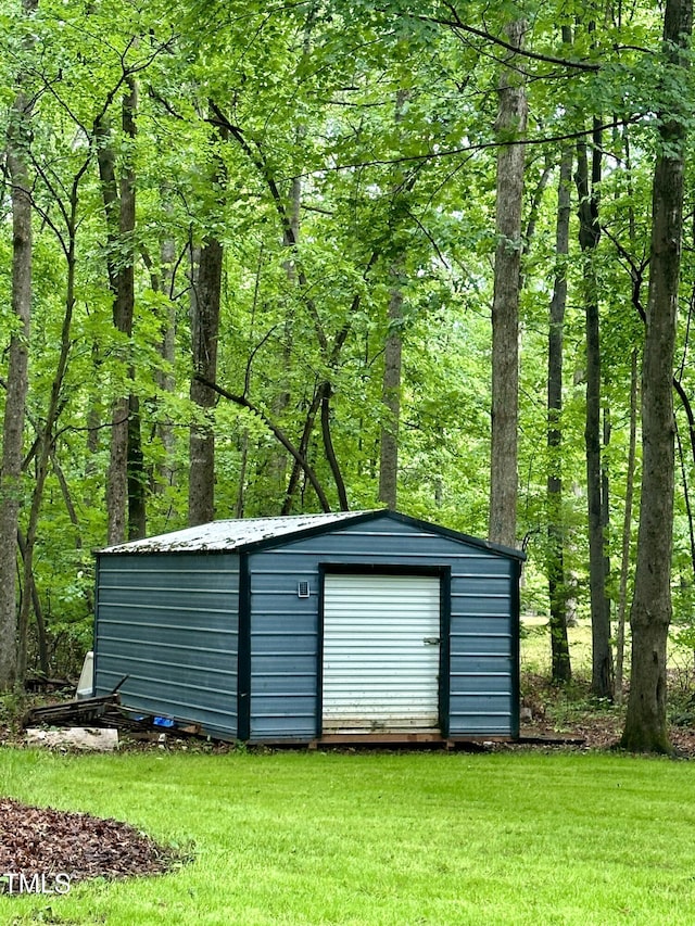view of shed featuring a wooded view