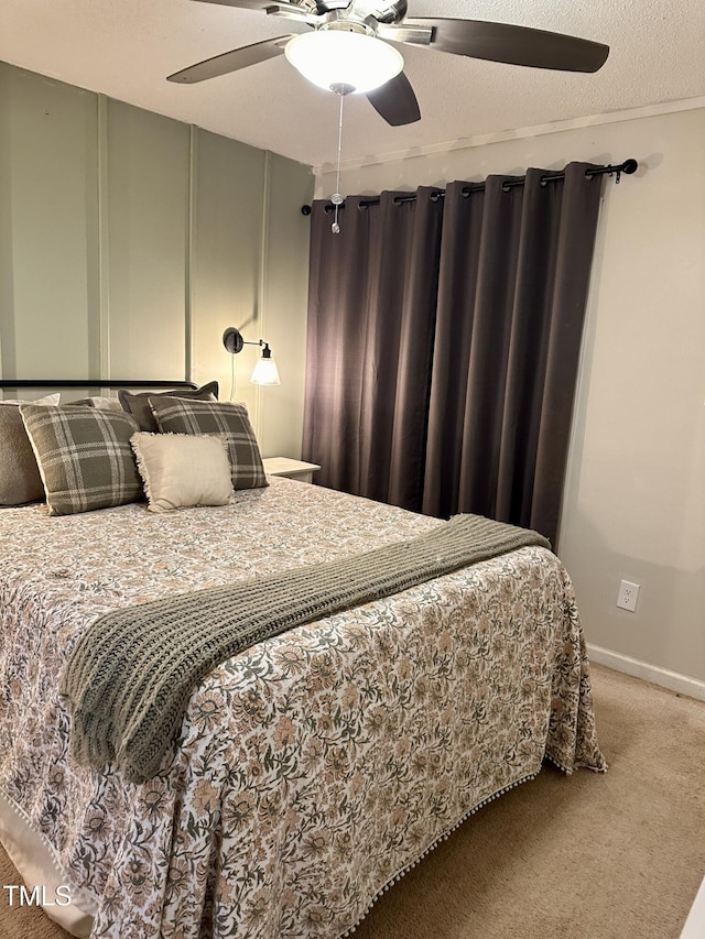 bedroom featuring carpet, ceiling fan, and baseboards