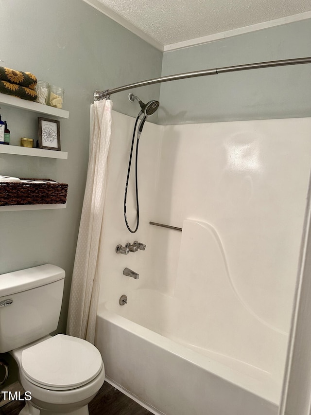 full bathroom featuring a textured ceiling, toilet, shower / bath combo with shower curtain, and wood finished floors