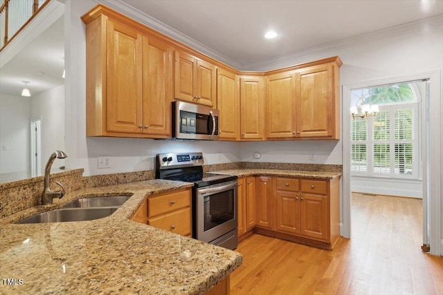 6335 Cedar Waters Dr, Raleigh, NC 27607 - kitchen featuring stainless steel appliances, a sink, light stone counters, light wood-style floors, and crown molding