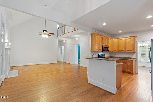 6335 Cedar Waters Dr, Raleigh, NC 27607 - kitchen featuring appliances with stainless steel finishes, light wood-style floors, baseboards, recessed lighting, and a ceiling fan