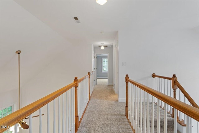 6335 Cedar Waters Dr, Raleigh, NC 27607 - corridor featuring light colored carpet and an upstairs landing