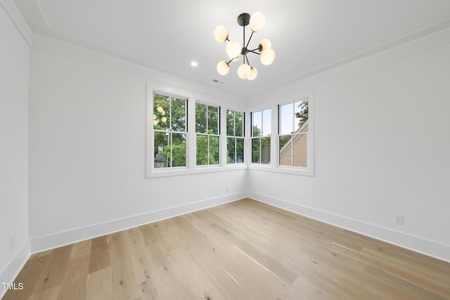 empty room featuring a chandelier, baseboards, light wood-type flooring, and recessed lighting