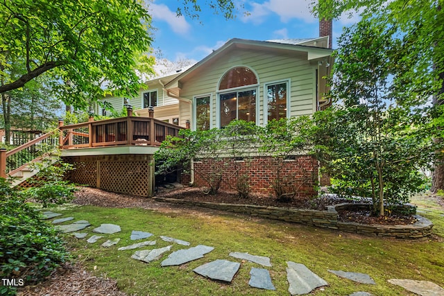 105 Windfall Ct, Cary, NC 27518 - back of house with a wooden deck, a yard, and a chimney