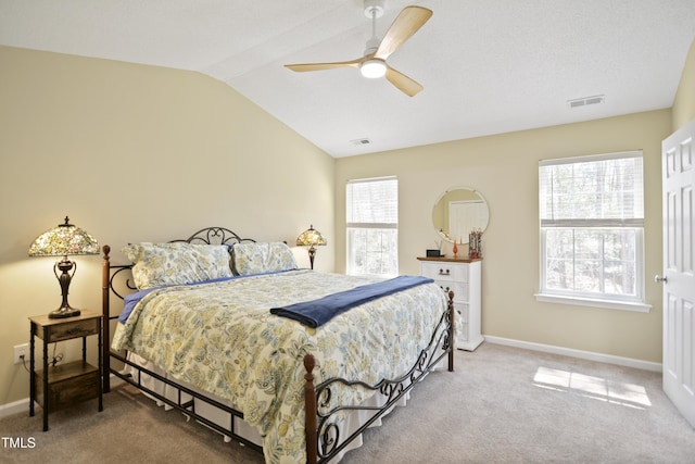 bedroom with lofted ceiling, carpet floors, baseboards, and ceiling fan