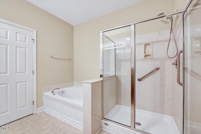 bathroom featuring a bath and a shower stall