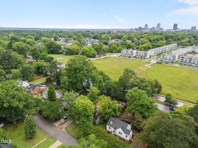 drone / aerial view of a tree filled landscape