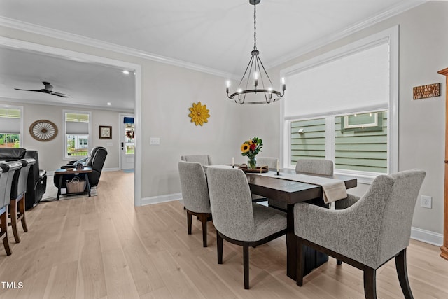 dining room with a chandelier, light wood-style flooring, ornamental molding, ceiling fan, and baseboards