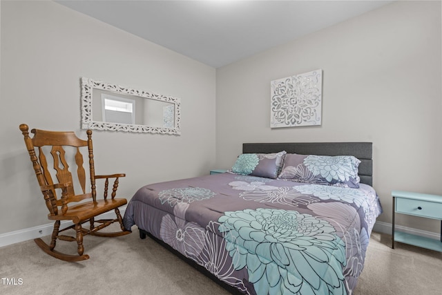 bedroom with carpet floors and baseboards