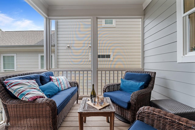 sunroom featuring an outdoor hangout area