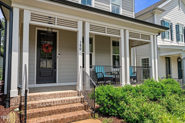 doorway to property featuring covered porch