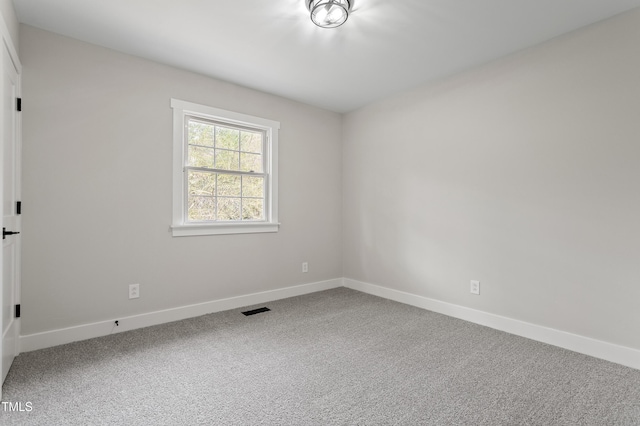 4307 Pope Rd, Durham, NC 27707 - carpeted spare room featuring baseboards