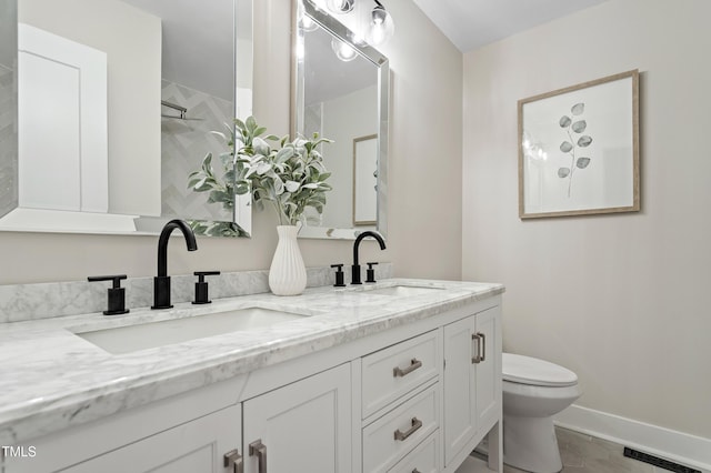 4307 Pope Rd, Durham, NC 27707 - full bathroom featuring toilet, double vanity, baseboards, and a shower
