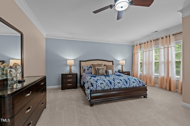 bedroom featuring light carpet, crown molding, baseboards, and a ceiling fan