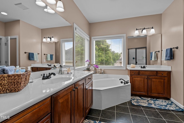 full bath featuring a shower stall, a garden tub, tile patterned flooring, and two vanities