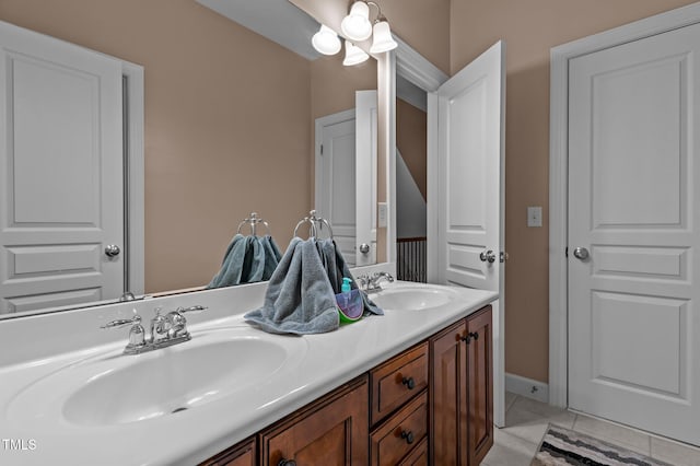 bathroom with double vanity and tile patterned flooring