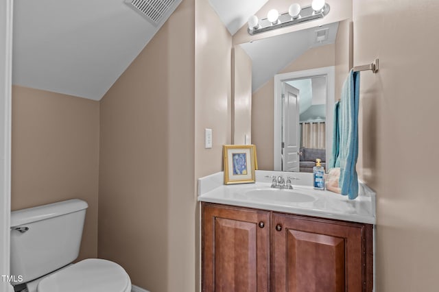 bathroom with toilet and vanity