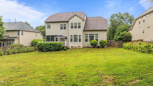 back of house featuring crawl space, a shingled roof, a sunroom, and a deck