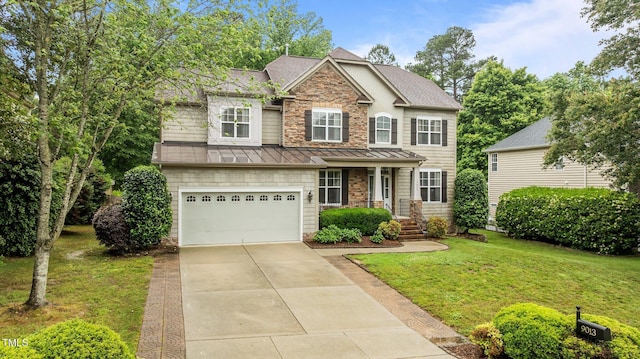 craftsman-style house featuring a standing seam roof, a front yard, concrete driveway, a garage, and a shingled roof