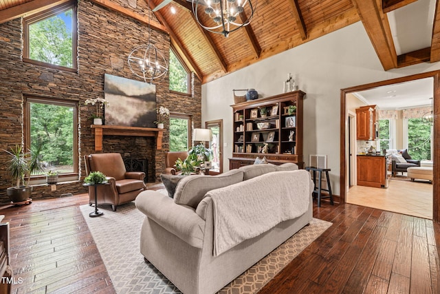 53 Lake Wendell Rd, Wendell, NC 27591 - living room with a chandelier, high vaulted ceiling, dark wood-style flooring, a wooden ceiling with exposed beams, and plenty of natural light
