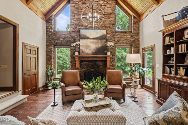 53 Lake Wendell Rd, Wendell, NC 27591 - living room featuring a wood ceiling with exposed beams, high vaulted ceiling, hardwood / wood-style flooring, plenty of natural light, and a stone fireplace