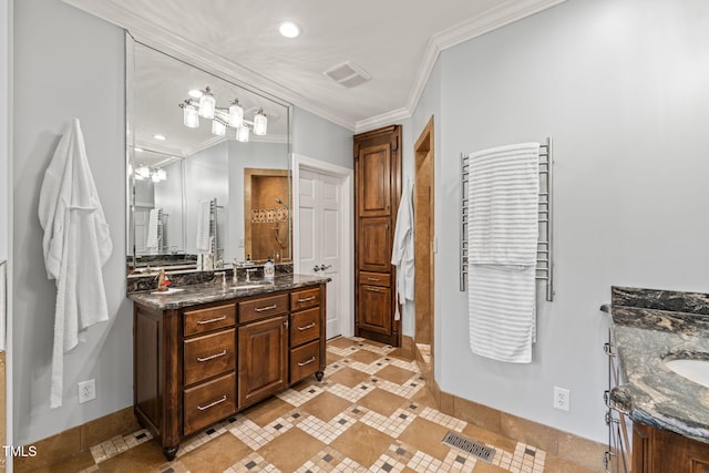 53 Lake Wendell Rd, Wendell, NC 27591 - full bathroom featuring two vanities, tile patterned floors, crown molding, recessed lighting, and inlaid floor details