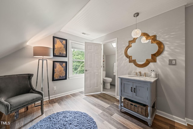 53 Lake Wendell Rd, Wendell, NC 27591 - bathroom with wood finished floors, vanity, and vaulted ceiling