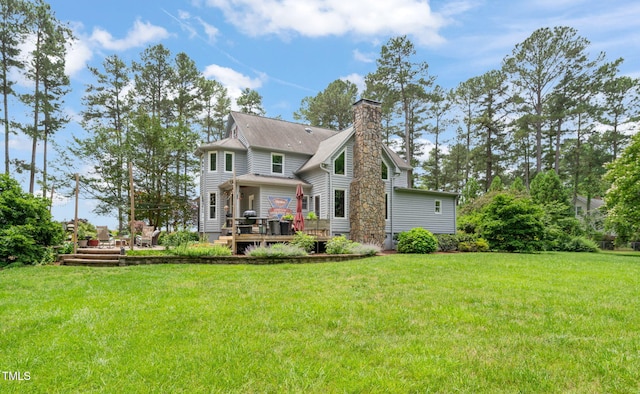 53 Lake Wendell Rd, Wendell, NC 27591 - back of house with a wooden deck, a chimney, and a lawn