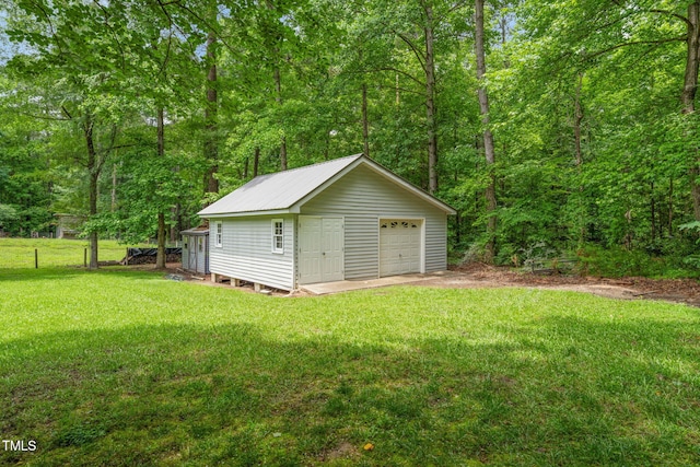 53 Lake Wendell Rd, Wendell, NC 27591 - detached garage with a forest view