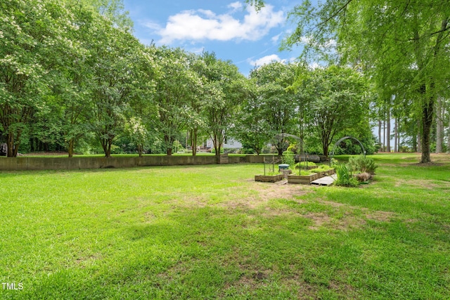 53 Lake Wendell Rd, Wendell, NC 27591 - view of green lawn with a garden